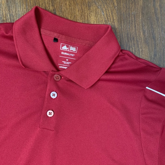 maroon golf shirt